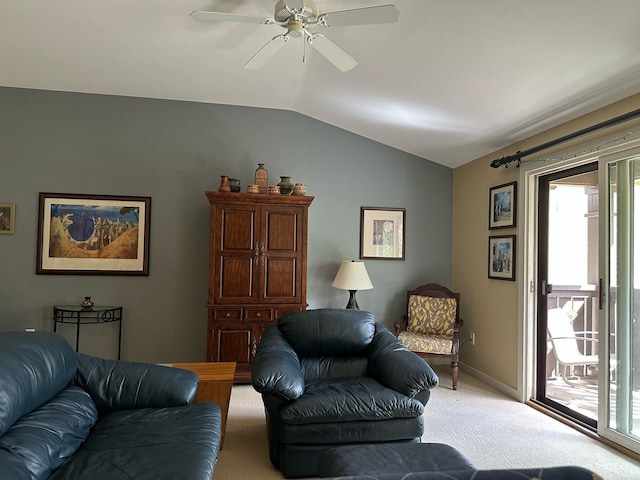 living area with a healthy amount of sunlight, light colored carpet, lofted ceiling, and a ceiling fan