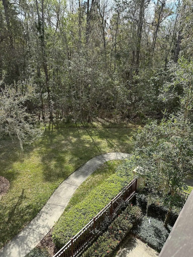 view of yard with a wooded view