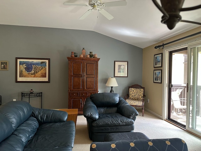 living room featuring a healthy amount of sunlight, light colored carpet, lofted ceiling, and ceiling fan