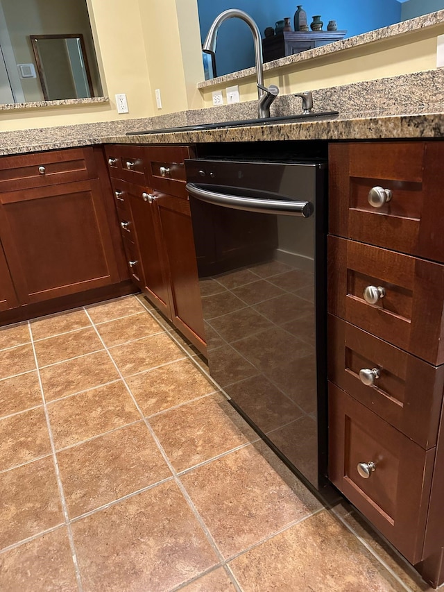 kitchen featuring light tile patterned floors, beverage cooler, and light stone countertops