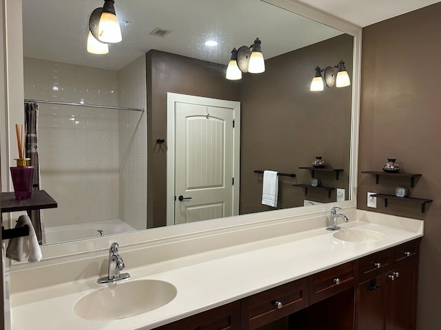 bathroom with a sink, visible vents, shower / washtub combination, and double vanity