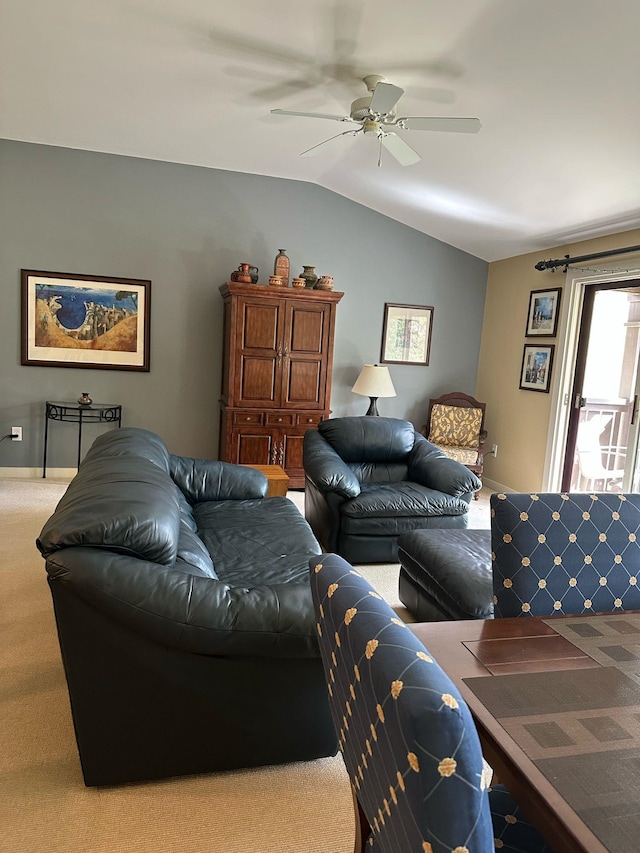 carpeted living room with baseboards, lofted ceiling, and a ceiling fan