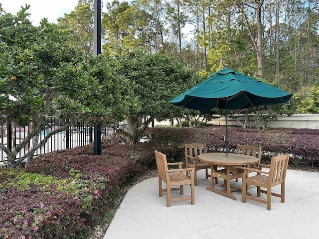 view of patio / terrace with outdoor dining area and fence