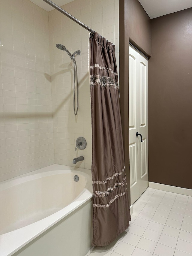 bathroom with tile patterned floors and shower / tub combo with curtain