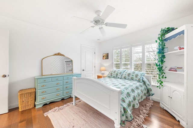 bedroom featuring ceiling fan and wood finished floors