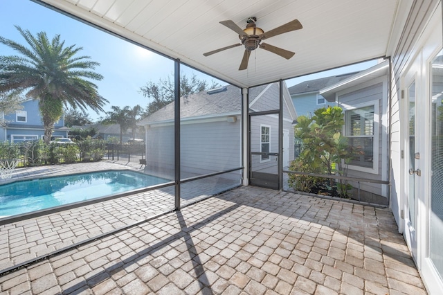 view of swimming pool featuring a patio, fence, a ceiling fan, and a fenced in pool