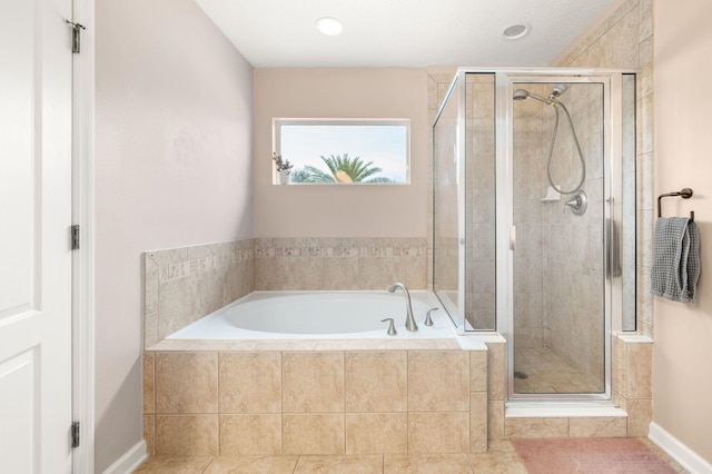 full bath with tile patterned flooring, a shower stall, a bath, and baseboards