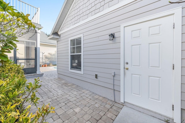 entrance to property featuring a patio