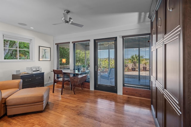 office space with recessed lighting, ceiling fan, light wood finished floors, and a wealth of natural light