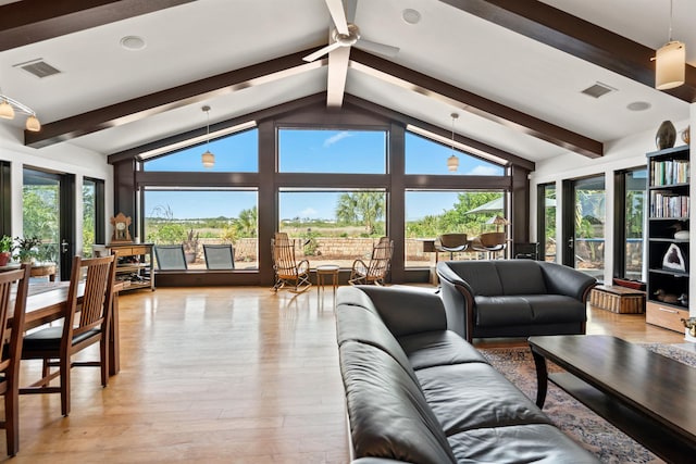 living area with vaulted ceiling with beams, ceiling fan, visible vents, and light wood-type flooring