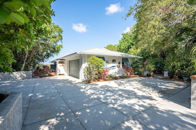 single story home with a garage