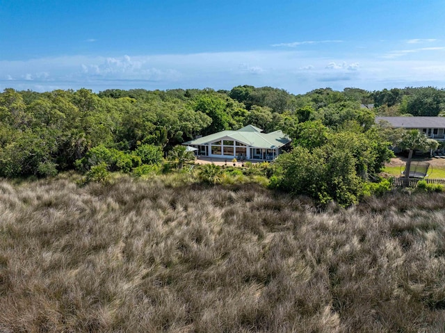 birds eye view of property with a wooded view