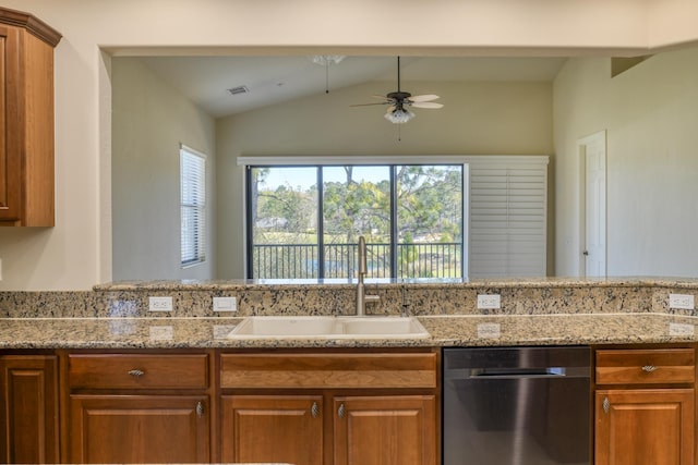 kitchen featuring a sink, brown cabinets, dishwasher, and ceiling fan