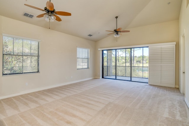 unfurnished room with visible vents, light carpet, baseboards, and ceiling fan