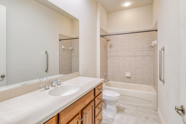 bathroom with tile patterned flooring, shower / washtub combination, toilet, and vanity