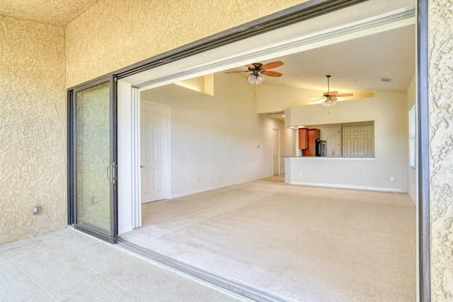 view of patio featuring ceiling fan