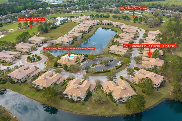 aerial view with a residential view and a water view