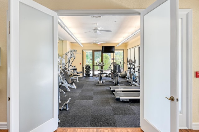 workout area featuring a ceiling fan and visible vents