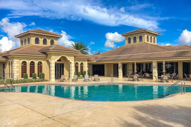 community pool featuring a patio