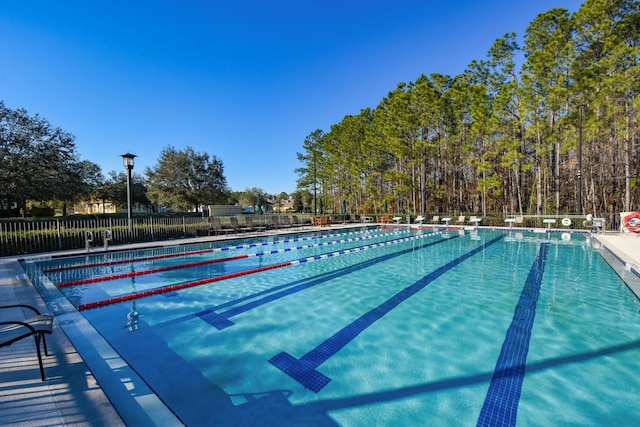 community pool featuring fence