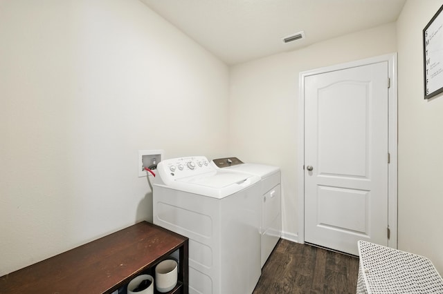 313 Caminha Rd, Saint Augustine, FL 32084 - laundry area with dark wood-style flooring and washer and dryer