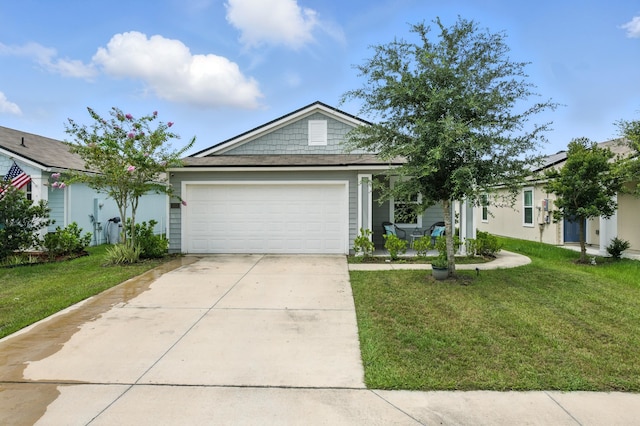 313 Caminha Rd, Saint Augustine, FL 32084 - view of front facade with a garage, driveway, and a front lawn