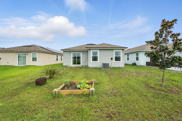313 Caminha Rd, Saint Augustine, FL 32084 - rear view of house with a garden and a yard