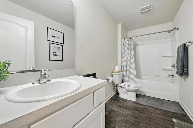 313 Caminha Rd, Saint Augustine, FL 32084 - full bathroom featuring vanity, wood finished floors, shower / bath combo with shower curtain, and a textured ceiling