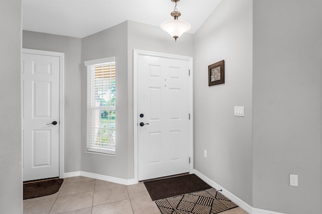 4 Contee Ct, Palm Coast, FL 32137 - foyer entrance featuring light tile patterned floors and baseboards