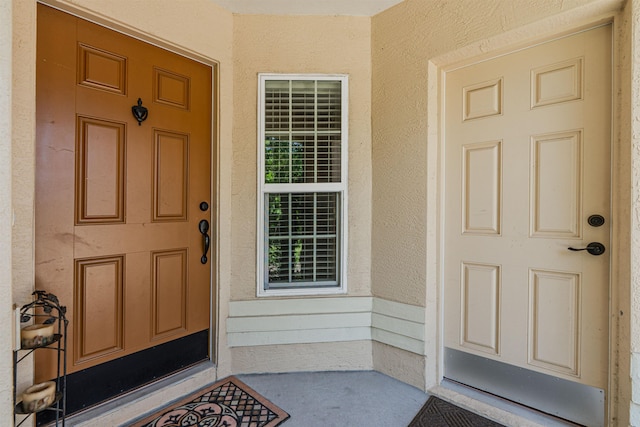 4 Contee Ct, Palm Coast, FL 32137 - property entrance with stucco siding