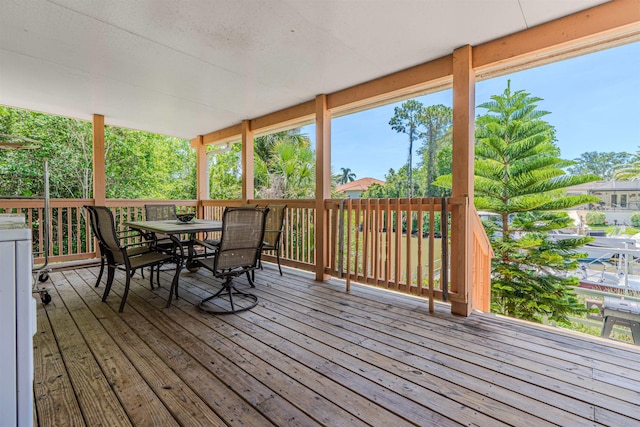 4 Contee Ct, Palm Coast, FL 32137 - wooden terrace with outdoor dining area