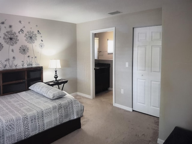 4 Contee Ct, Palm Coast, FL 32137 - carpeted bedroom featuring baseboards and ensuite bath