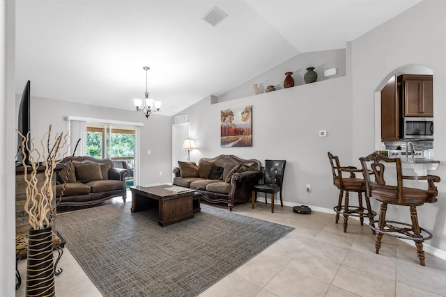 4 Contee Ct, Palm Coast, FL 32137 - living area with lofted ceiling, arched walkways, a chandelier, and light tile patterned floors