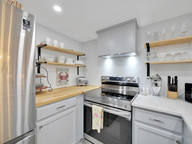 880 A1A Beach Blvd Unit 5113, Saint Augustine, FL 32080 - kitchen featuring appliances with stainless steel finishes, open shelves, recessed lighting, and white cabinets
