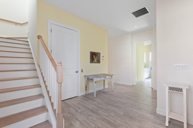 15 Cypresswood Dr, Palm Coast, FL 32137 - staircase featuring baseboards, visible vents, and wood finished floors