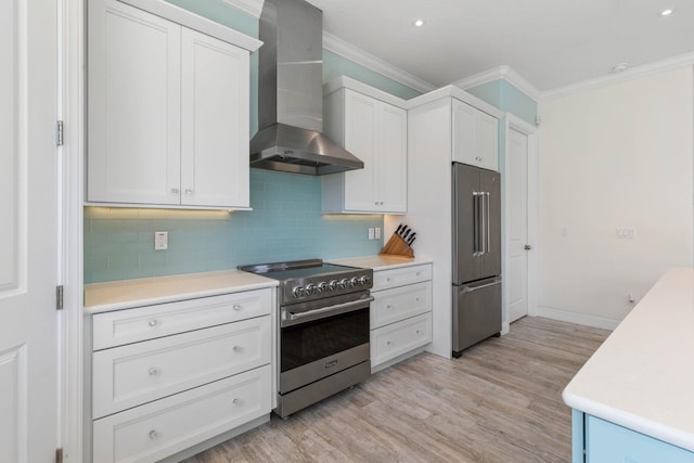 15 Cypresswood Dr, Palm Coast, FL 32137 - kitchen with wall chimney range hood, decorative backsplash, crown molding, light wood finished floors, and stainless steel appliances