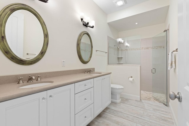 15 Cypresswood Dr, Palm Coast, FL 32137 - bathroom featuring a sink, a stall shower, toilet, and double vanity