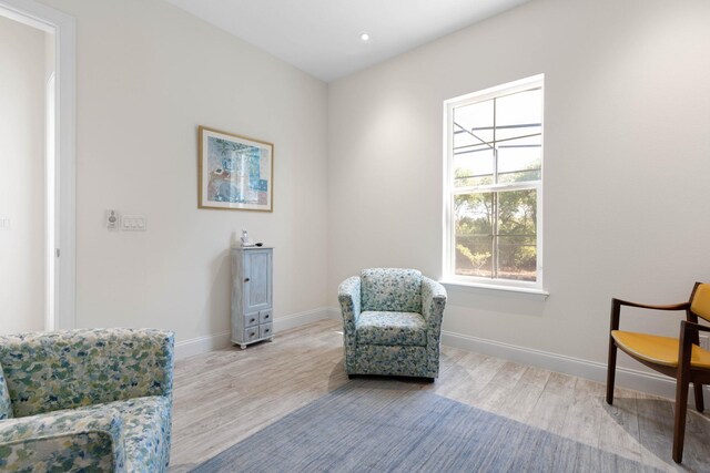15 Cypresswood Dr, Palm Coast, FL 32137 - living area featuring baseboards, recessed lighting, and wood finished floors