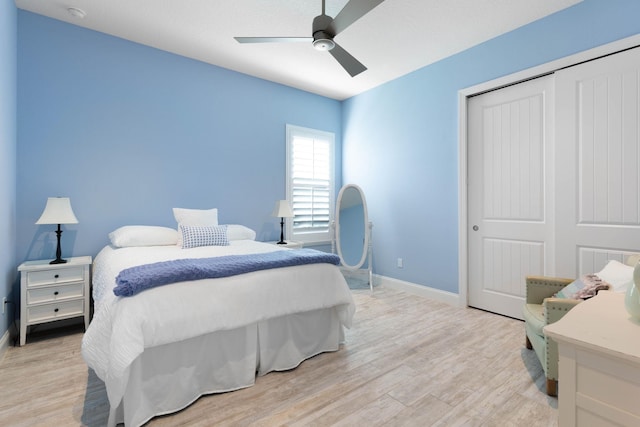 15 Cypresswood Dr, Palm Coast, FL 32137 - bedroom with baseboards, a closet, and light wood-style flooring