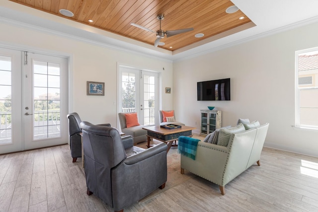 15 Cypresswood Dr, Palm Coast, FL 32137 - living area with a ceiling fan, a tray ceiling, french doors, and light wood-type flooring