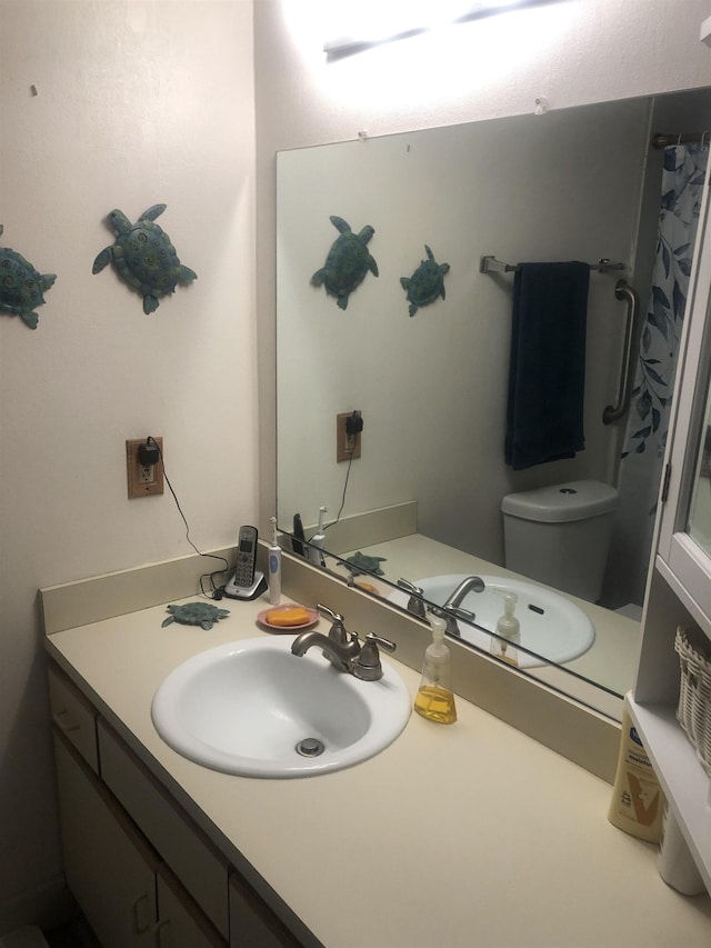 bathroom with vanity and toilet