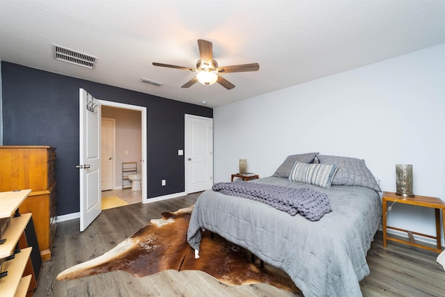 4420 Cedar Ford Blvd, Hastings, FL 32145 - bedroom with wood finished floors, a ceiling fan, and connected bathroom