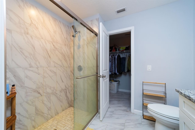 4420 Cedar Ford Blvd, Hastings, FL 32145 - bathroom featuring a shower stall, marble finish flooring, a walk in closet, and vanity