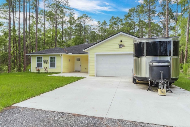 4420 Cedar Ford Blvd, Hastings, FL 32145 - ranch-style house with a garage, concrete driveway, and a front yard