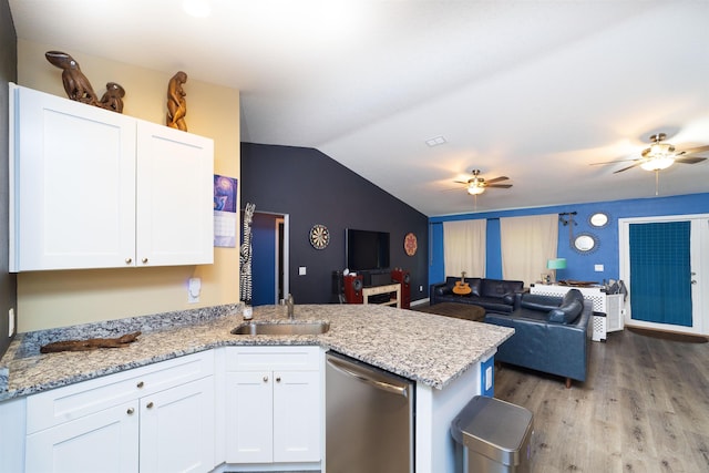 4420 Cedar Ford Blvd, Hastings, FL 32145 - kitchen featuring stainless steel dishwasher, a ceiling fan, a peninsula, white cabinetry, and vaulted ceiling