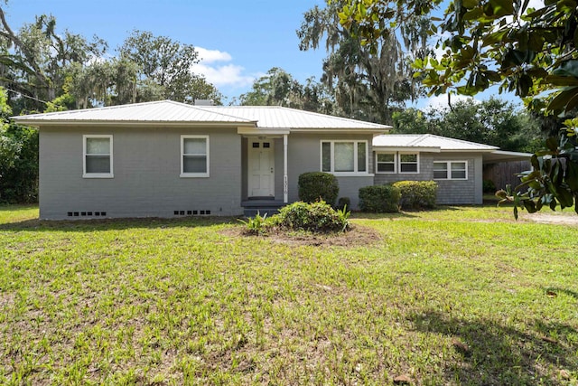 1316 NE 9th St, Gainesville, FL 32605 - ranch-style house with a metal roof and a front yard