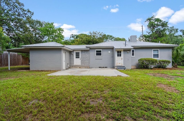 1316 NE 9th St, Gainesville, FL 32605 - rear view of house with a metal roof, a chimney, and a patio area