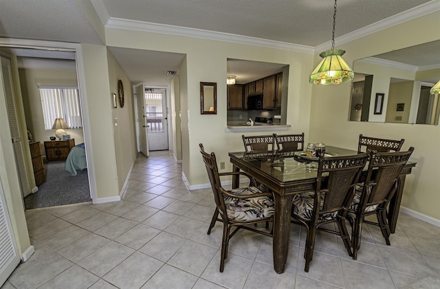 dining space with crown molding, light tile patterned floors, and a textured ceiling