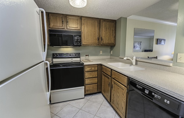 kitchen with sink, light tile patterned floors, black appliances, and a textured ceiling