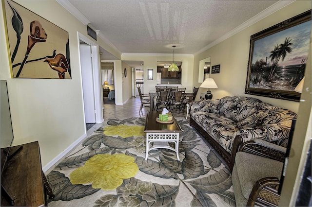 living room featuring light tile patterned floors, ornamental molding, and a textured ceiling